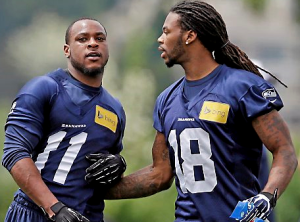 Percy Harvin and Sidney Rice during a minicamp in June (AP)