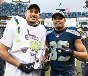 Jermaine Kearse and Doug Baldwin hold the NFC trophy after they came up big in overtime vs. the Packers (Seahawks.com)